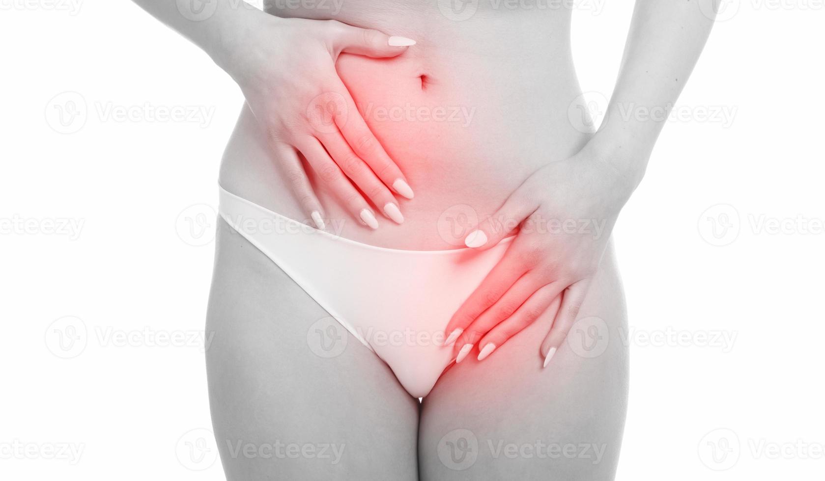 woman covering her crotch with her hands on white background Stock