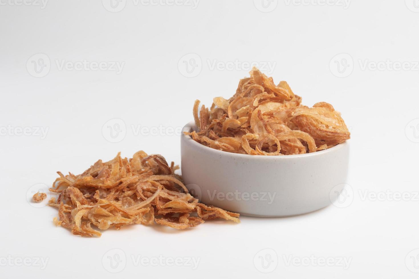 Crispy fried onion slices on a white background photo