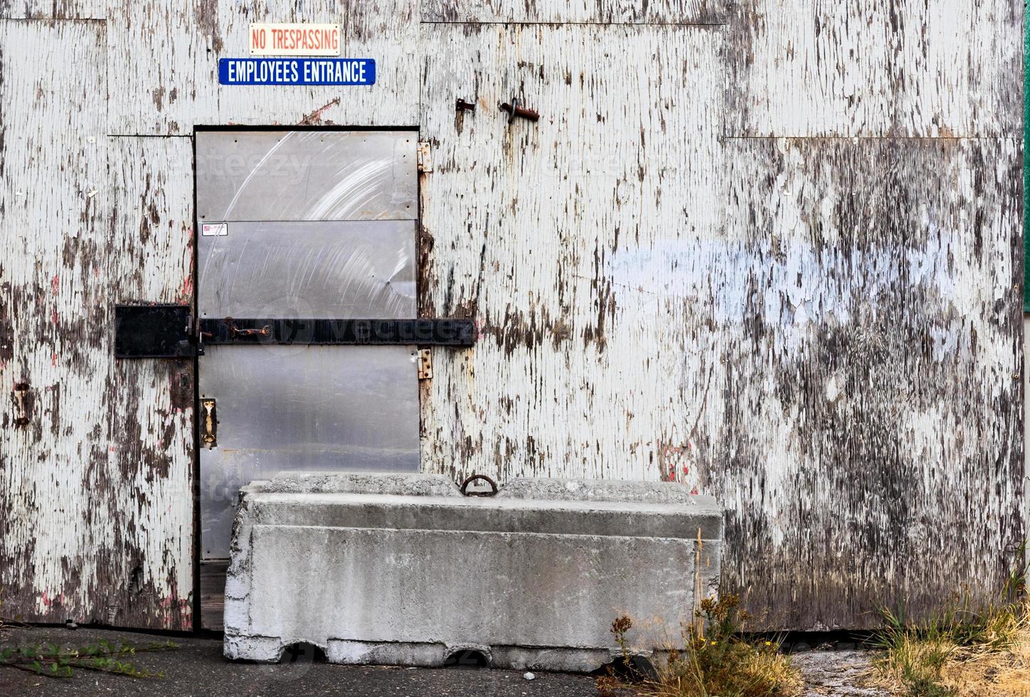 No trespassing employees only sign on an old building photo