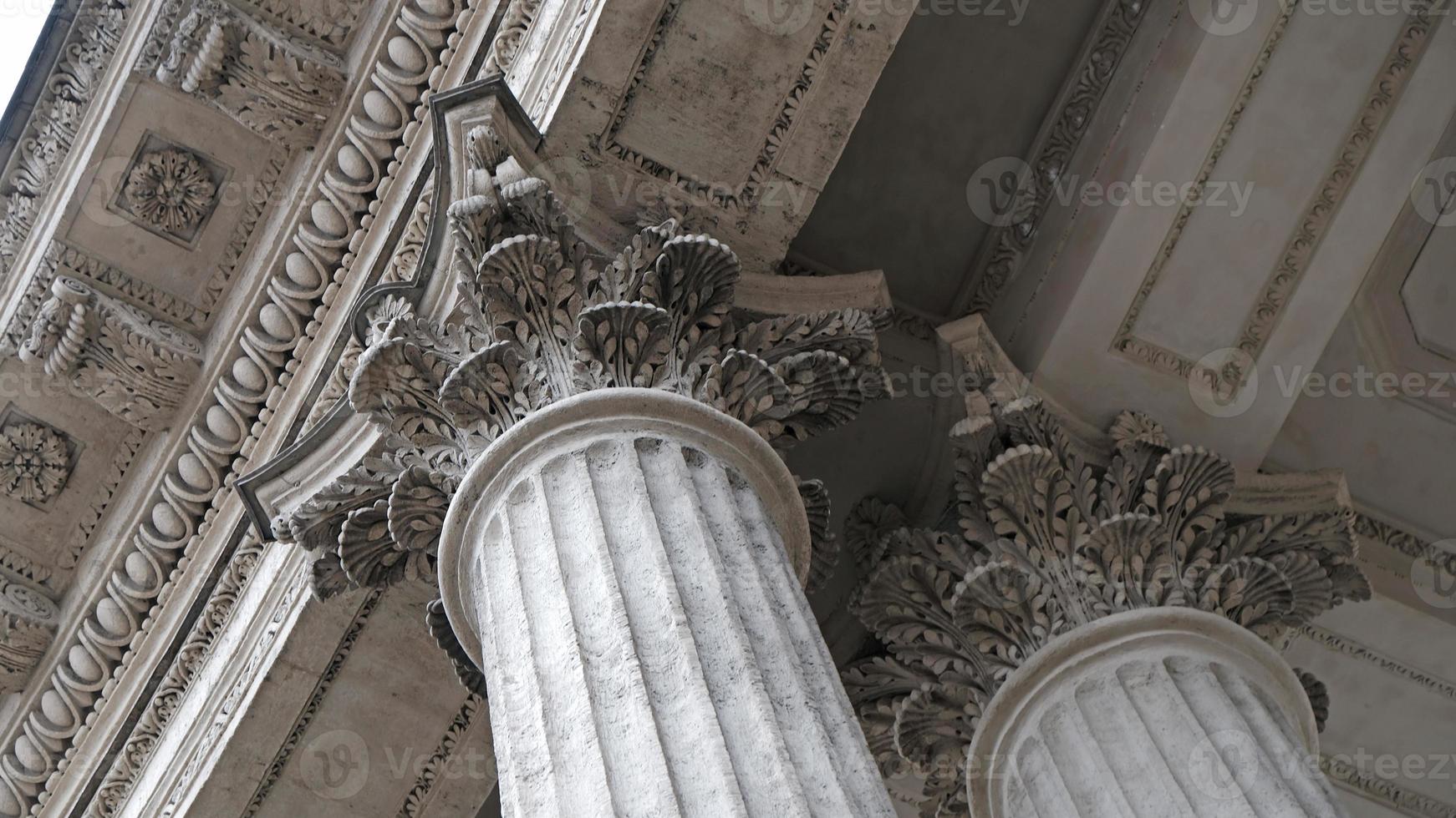 Classic architectural column. Details of the architecture of a historical building. Element of exterior building with columns and Stucco molding on the ceiling of Cathedral in St. Petersburg, Russia. photo
