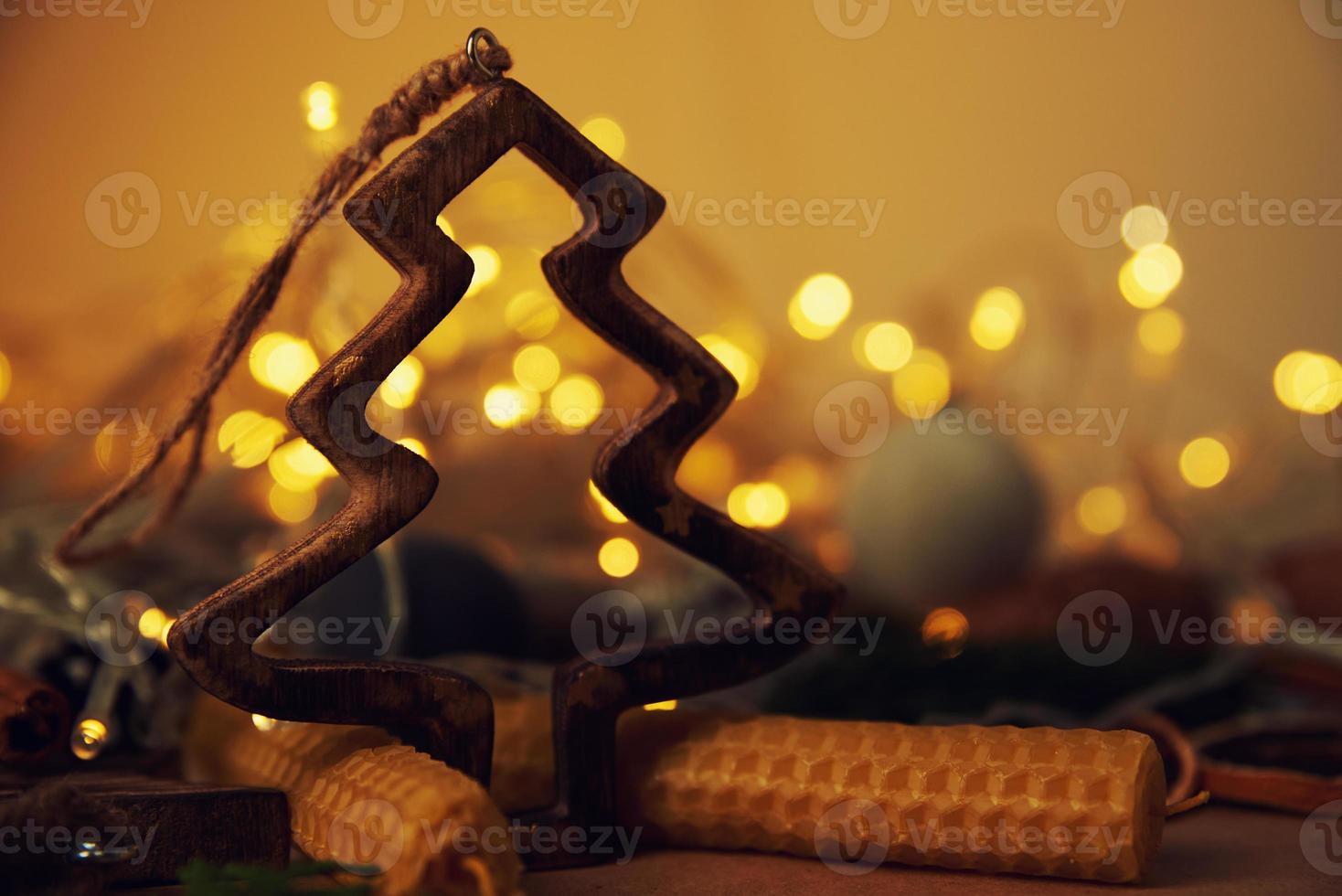 Christmas decorations with garland lights on dark background, top view photo