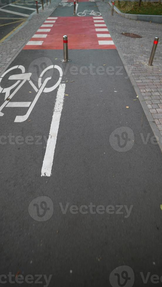 Jogger runs on a bicycle path in the city, first person view photo