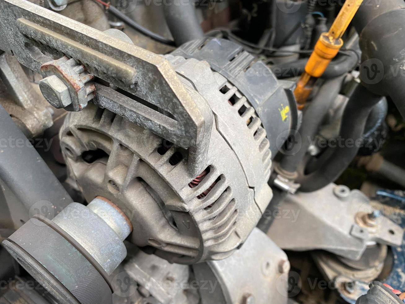 Engine compartment under car hood with emphasis on oil dipstick. Control, check and change oil concept photo