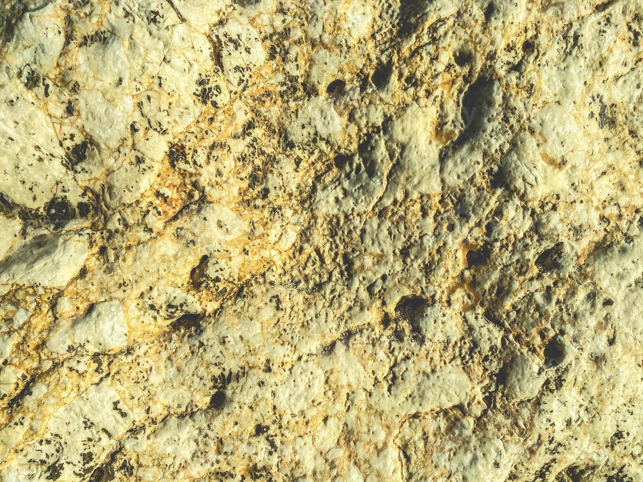 texture, stone on the beach near the sea. huge boulder of sand, rock. the stone lies on the seashore. natural background, 3d texture photo
