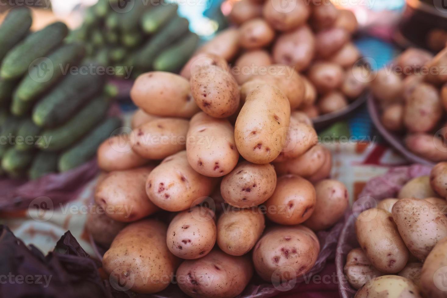 Closeup of potatoes on counter of farm market for sale. photo