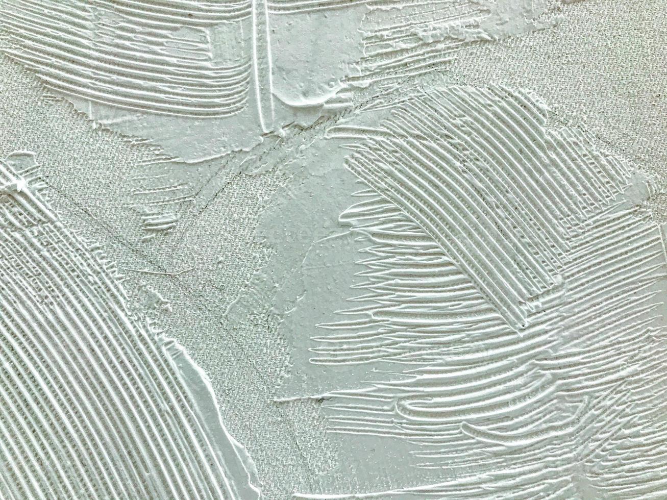 the canvas is painted with white paint. brush strokes on canvas. white paint creates a three-dimensional image using a comb, 3d texture photo