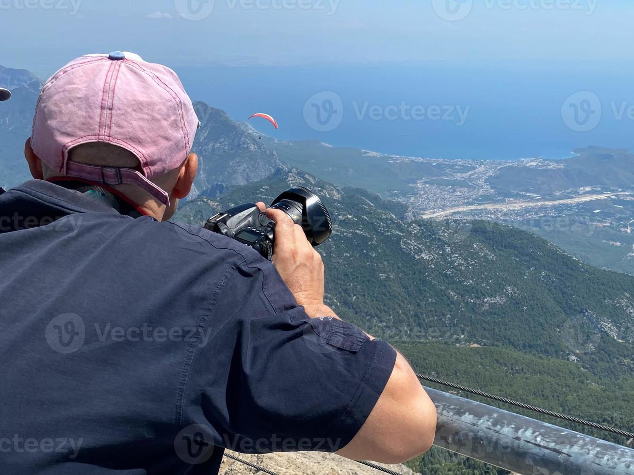 Young photographer in the mountains photo