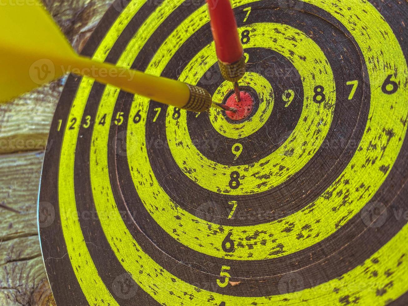 game of darts in the company. black and yellow cloth for throwing darts. aiming game, fun