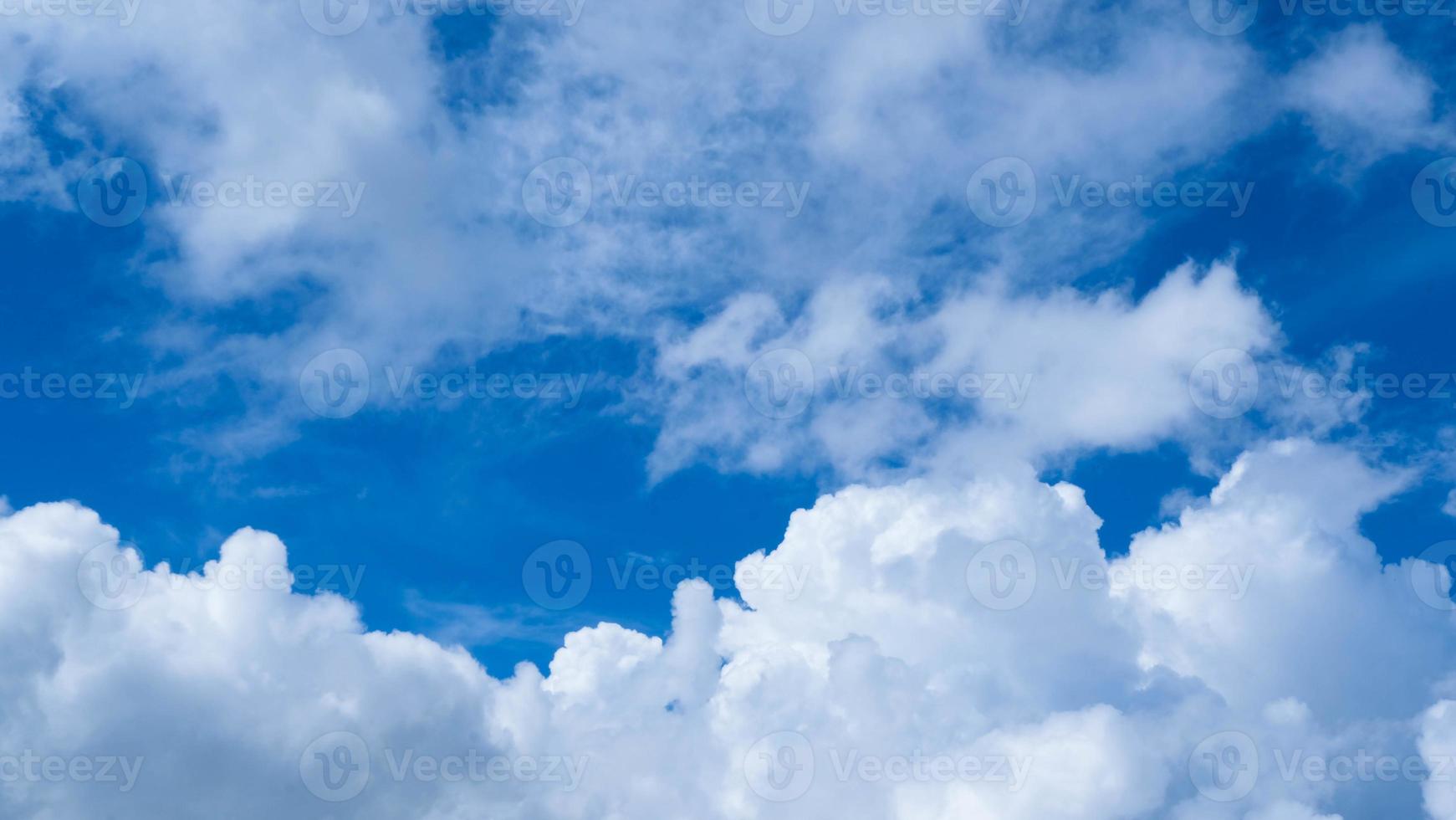 Aerial view of beautiful sky with clouds and sun on a summer day. Time