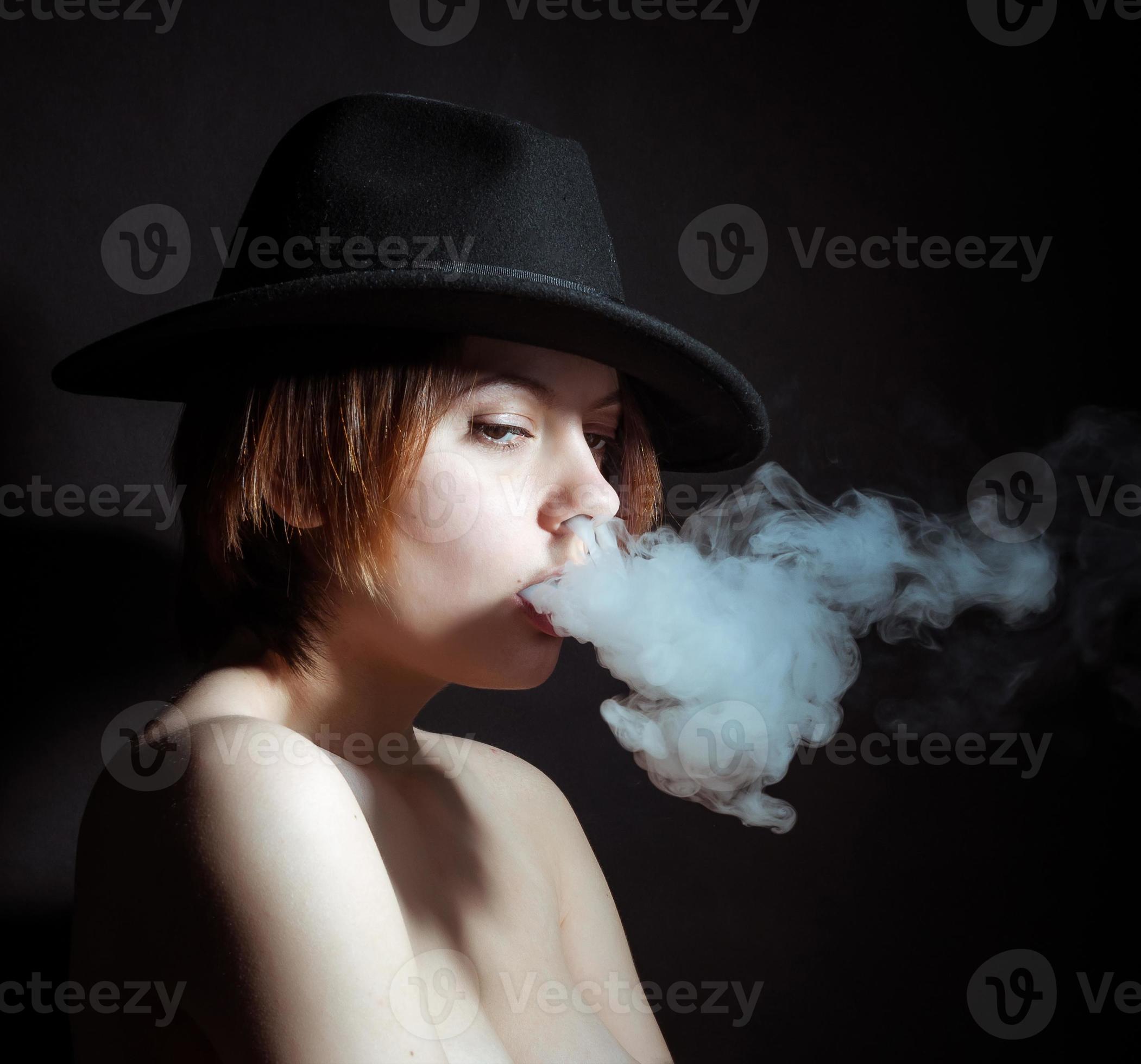 Portrait of a young girl in the smoke of cigarettes 15502003 Stock