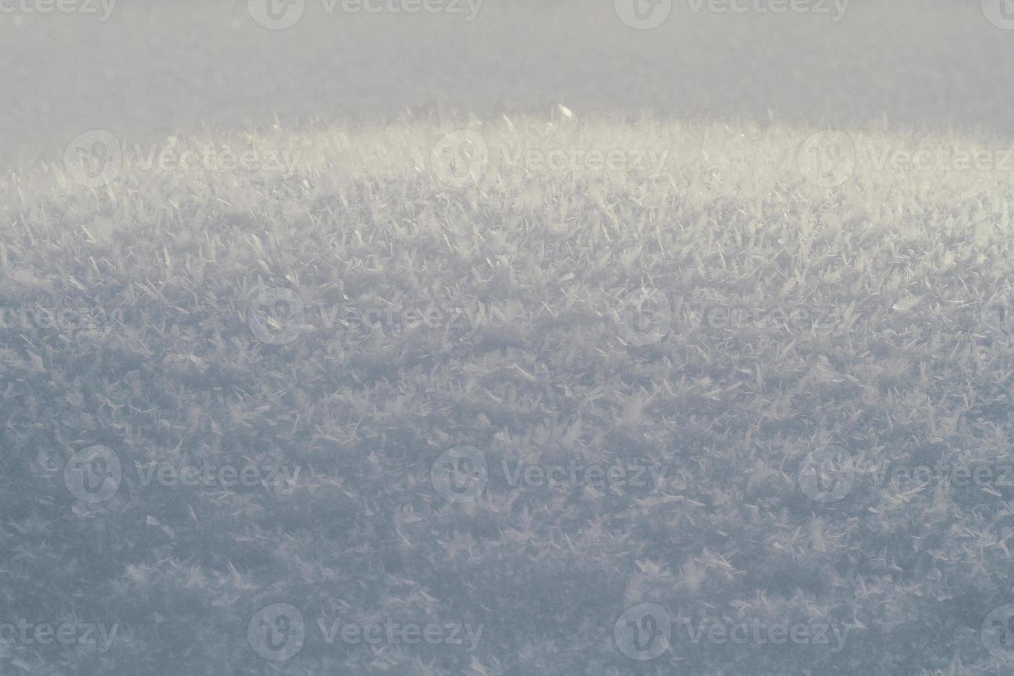 Close up snow pile with snowflakes macro shot concept photo