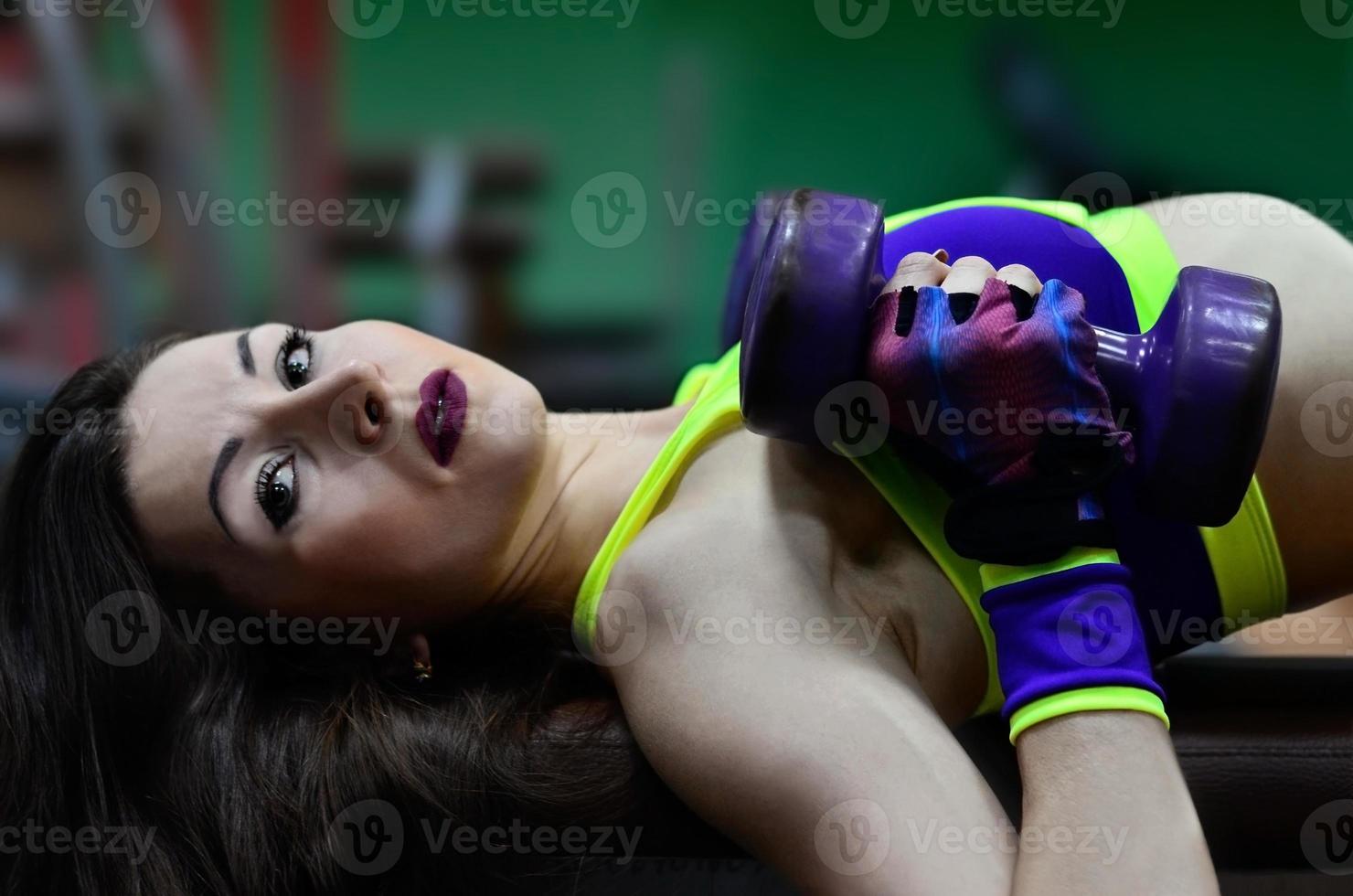 Athletic girl in a sport gym photo