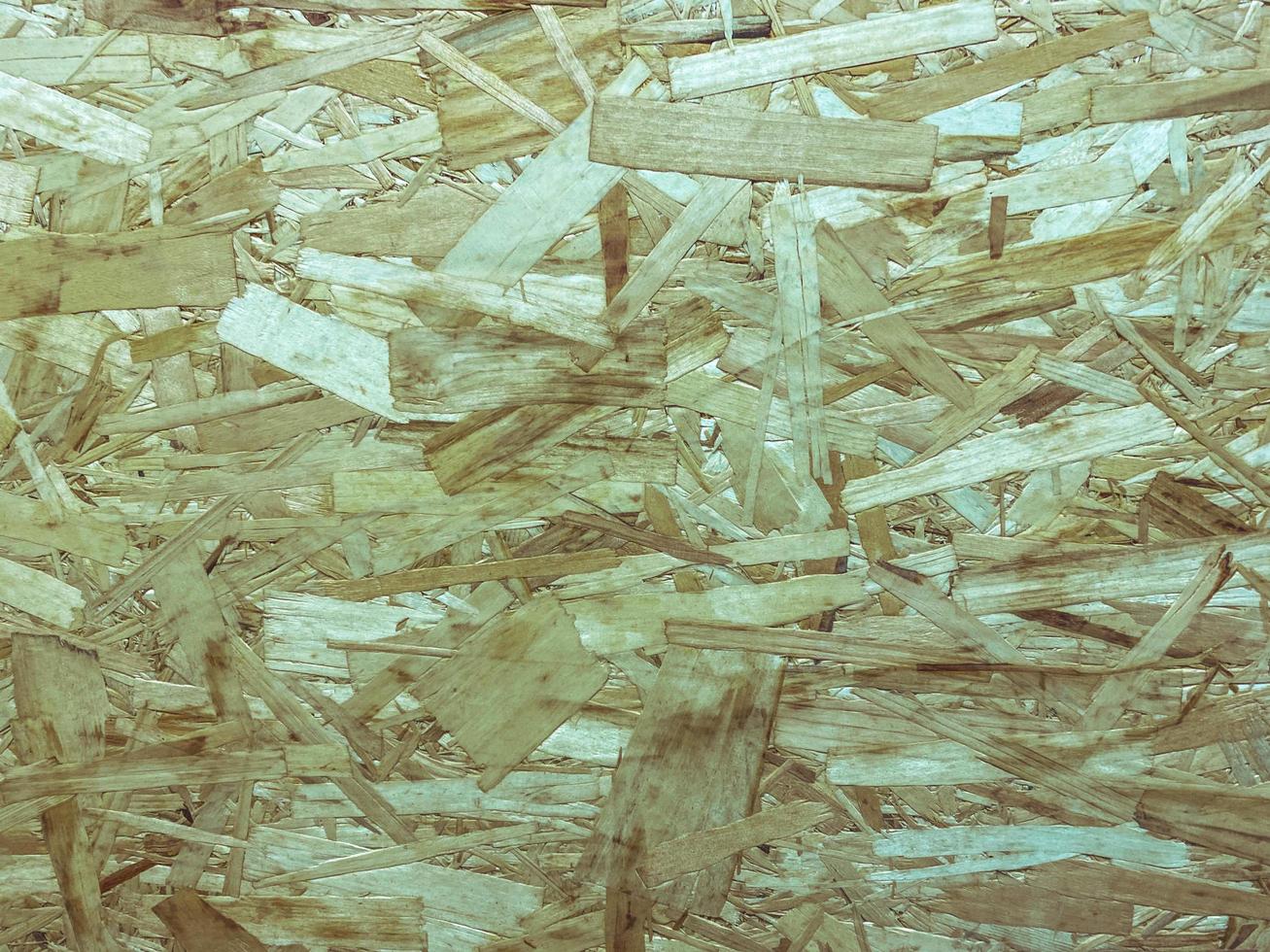 Pressed wooden panel background seamless texture of oriented strand board - OSB. photo