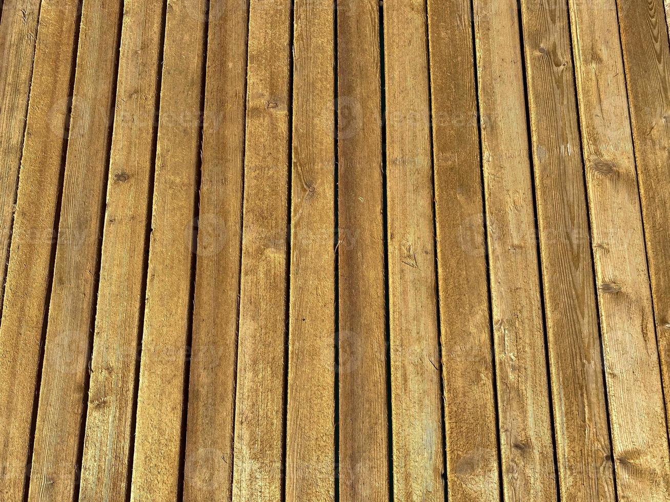 Vertical natural boards wooden brown with seams. Background, texture photo