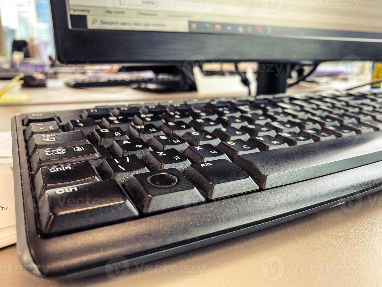 keyboard from a computer. office equipment for typing, employee tool for work. black keys with letters. 3D buttons photo