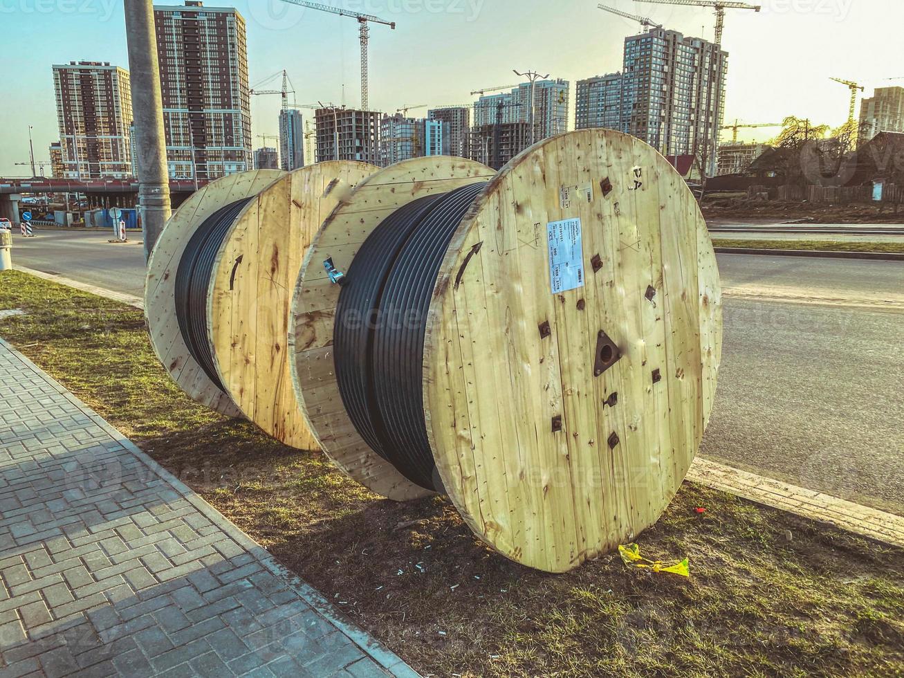 power line cable twisted into a ball. black line, construction of a new microdistrict in the city center. laying a cable to supply the microdistrict with electricity photo