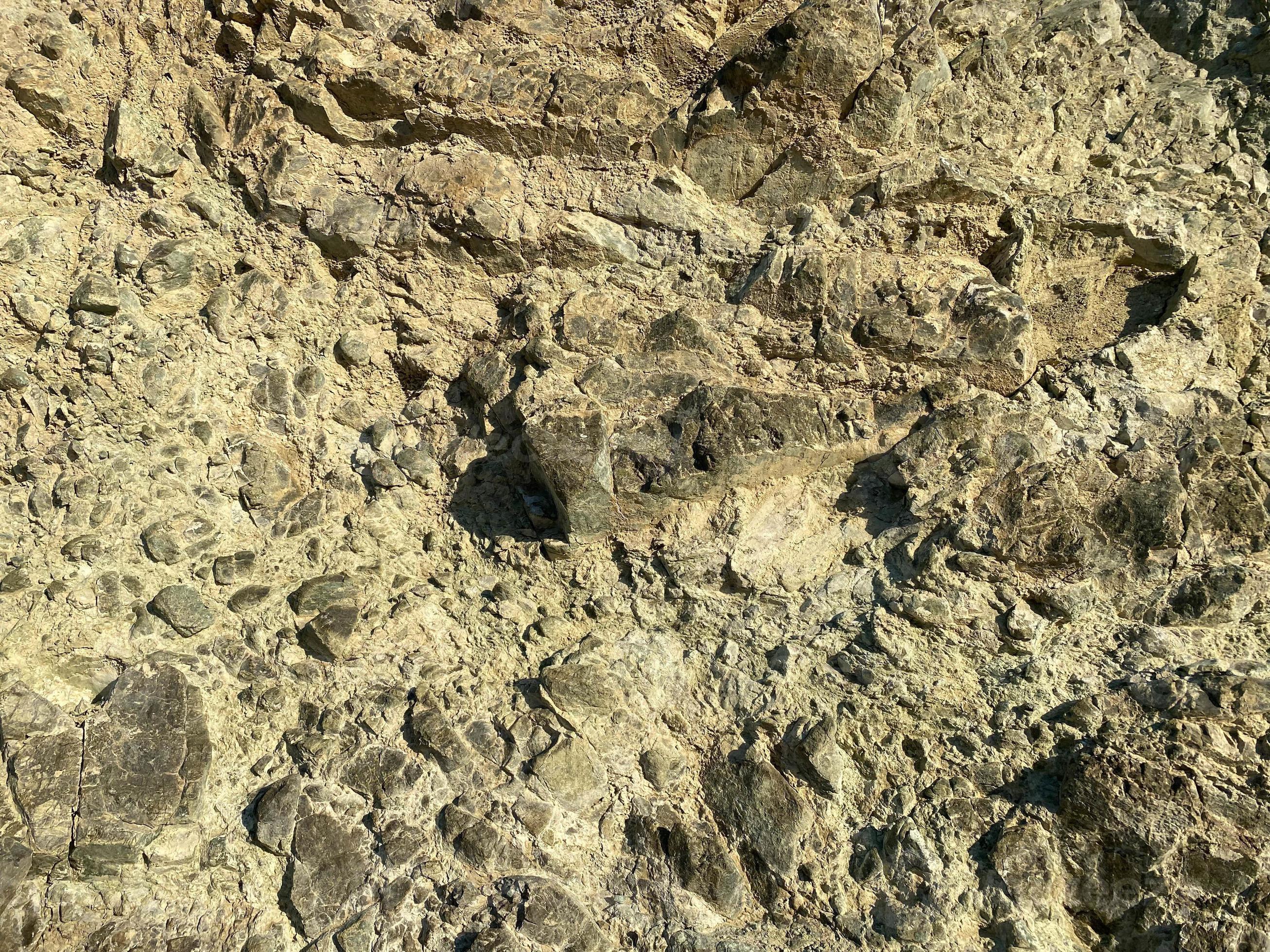 Rock texture. Stone background. Old weathered crumbling mountain surface in  cracks background. Light brown rock background 15569647 Stock Photo at  Vecteezy