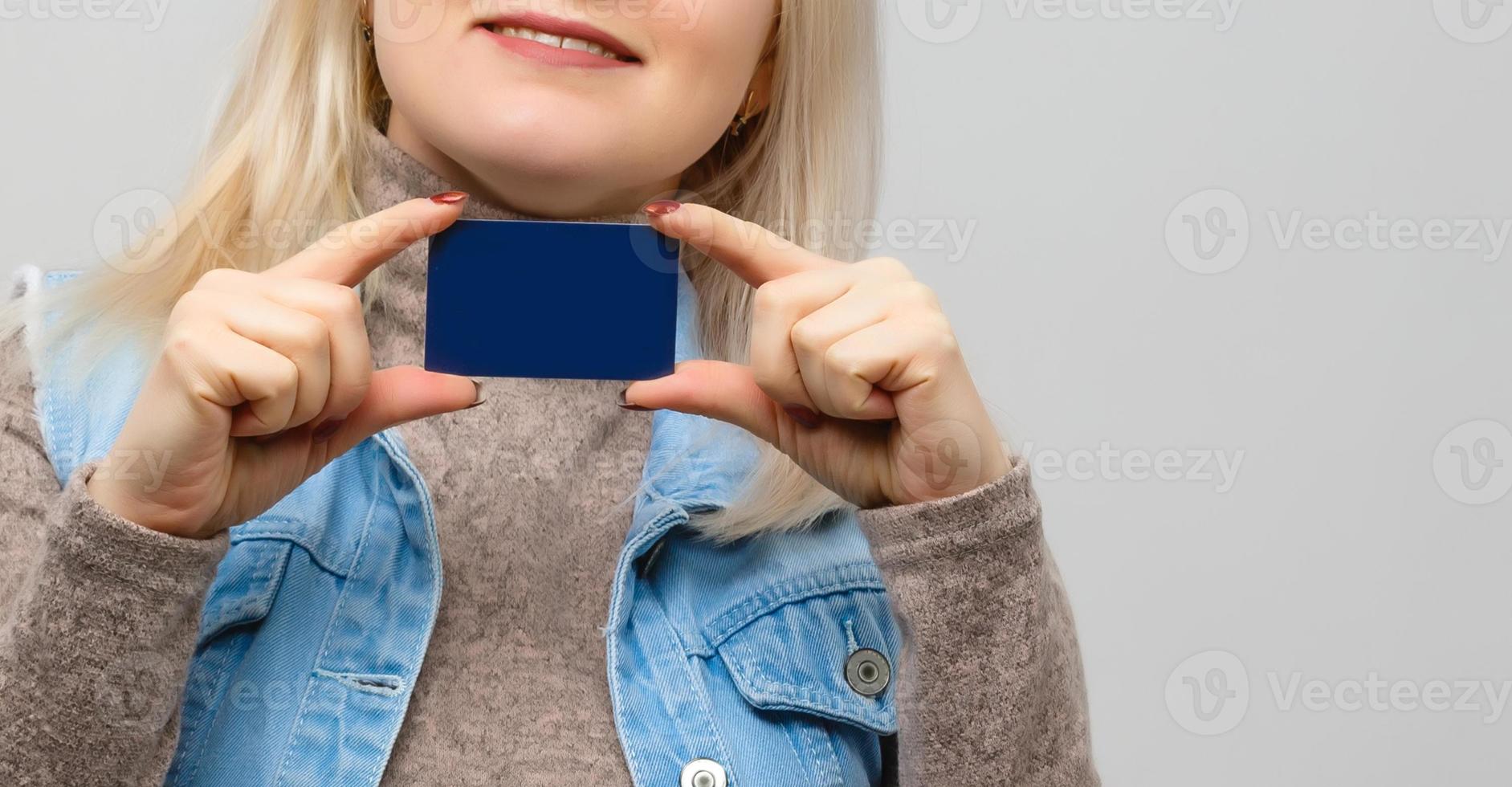 Female hands holding credit card, isolated on white photo