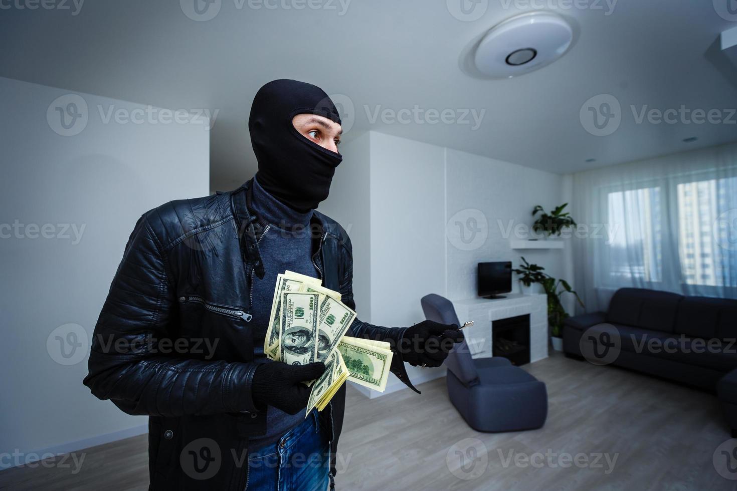 a thief man stole a TV. photo