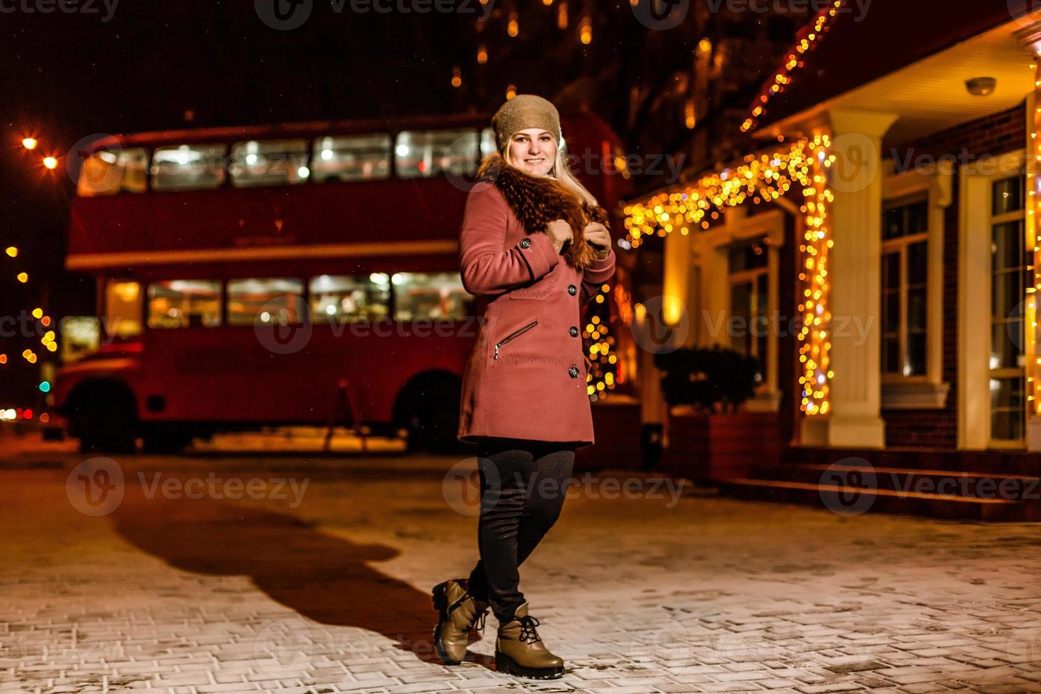 Night portrait of the girl in a winter city photo