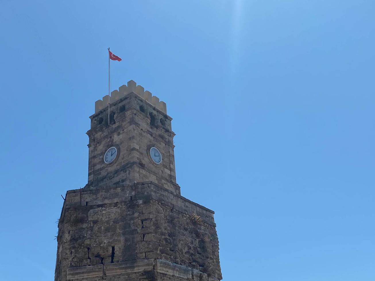 Old clock tower with blue and clouds sky in Adana, Turkey. Historical Old Clock Tower photo