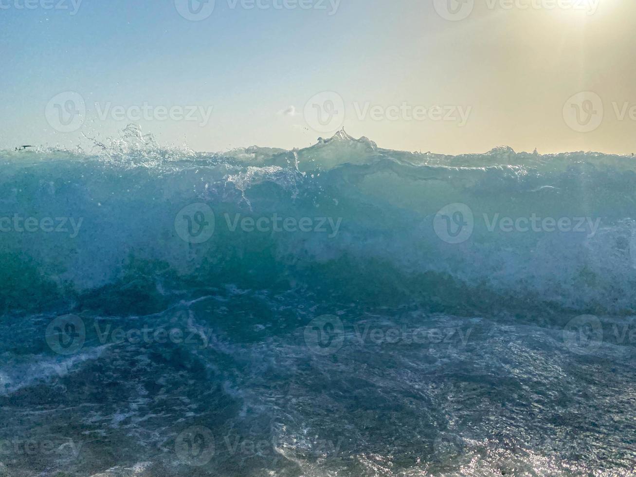 Waves, splashes of water on the beach at the sea on vacation in a tourist warm eastern tropical country southern paradise resort on vacation. The background photo