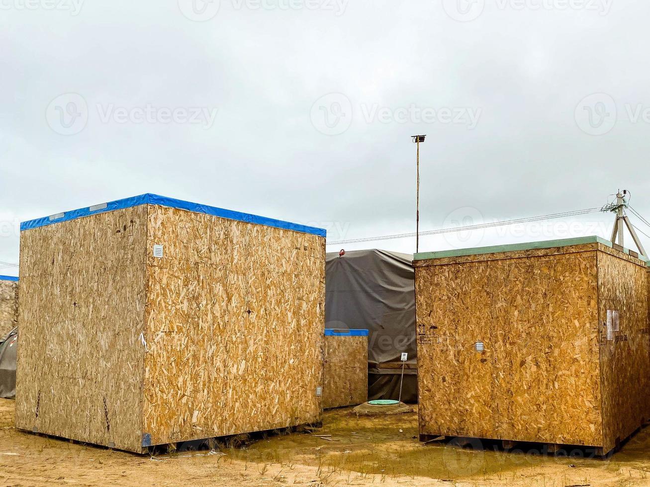 compressed sawdust are in a cube. a convenient form for sending building sawdust to production. sawdust with a roof for loading into trucks photo