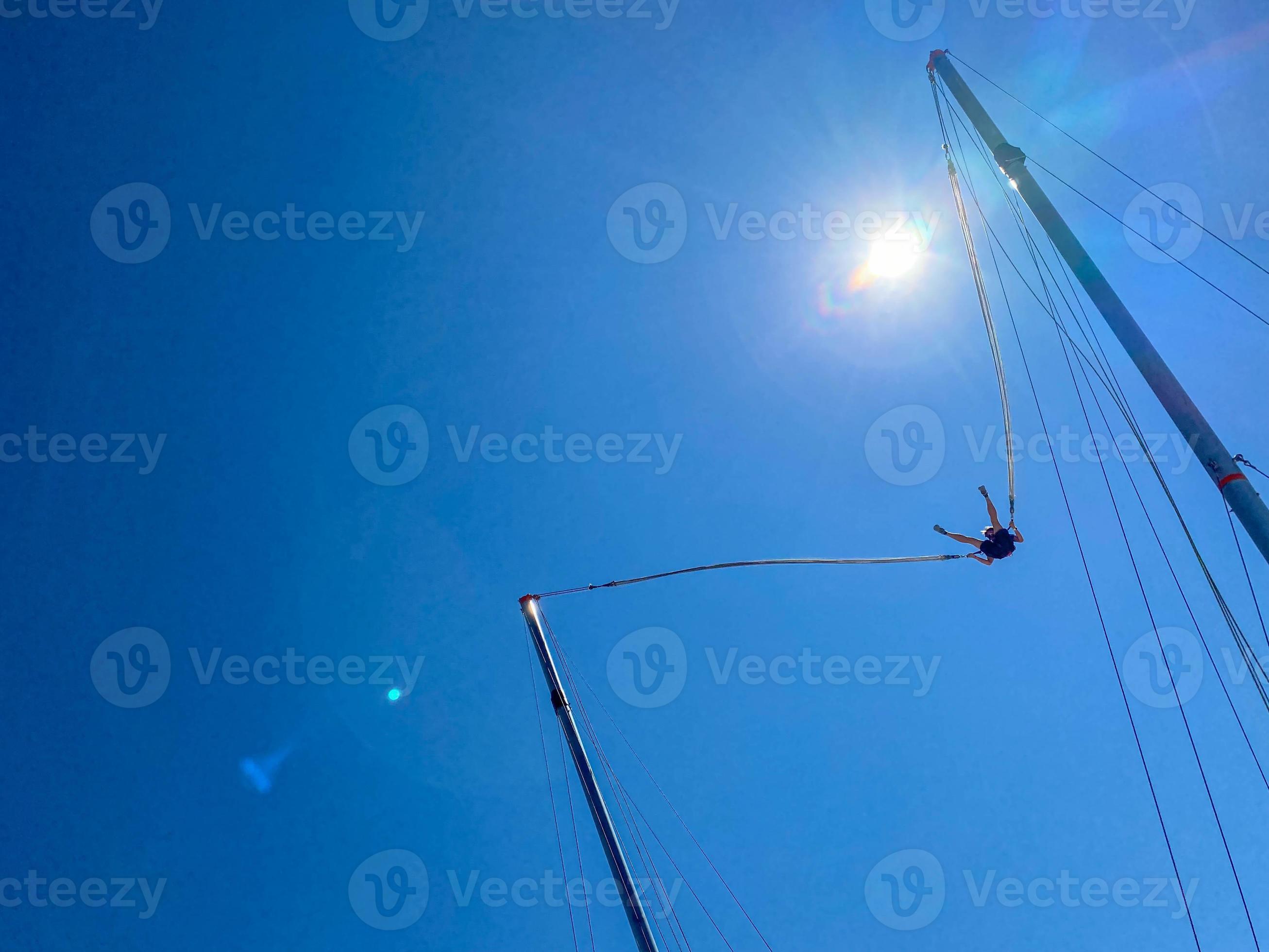 jumping rubber band in an amusement park 15583088 Stock Photo at Vecteezy