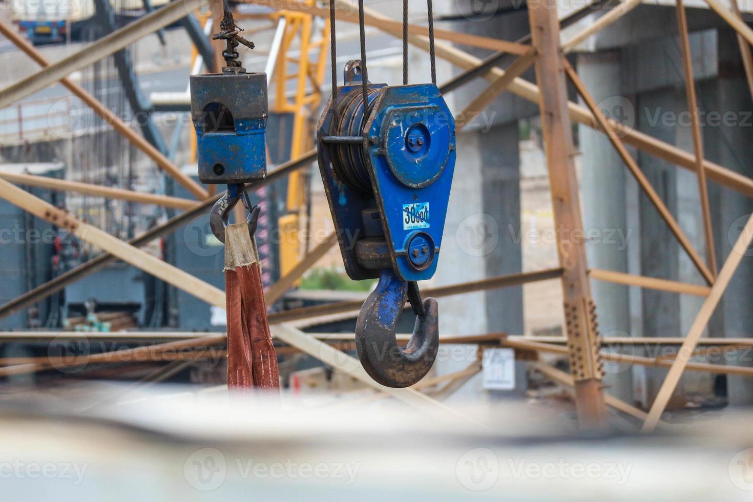 A hook is a tool used to help lift loads by hooking them up. photo