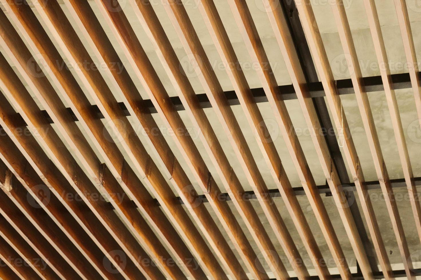 Wooden stairs with wooden railing in a building. photo