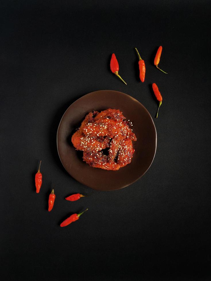 Fire spicy chicken wings with chili sauce glaze photo