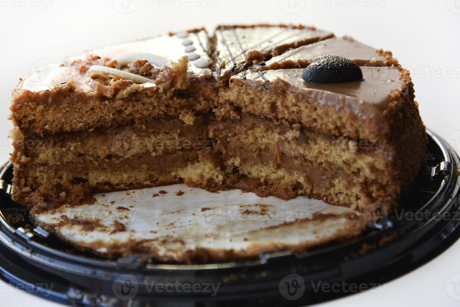 Delicious honey cake close-up. Sliced sweet cake on a white background. Slices of honey cake for the holiday. photo