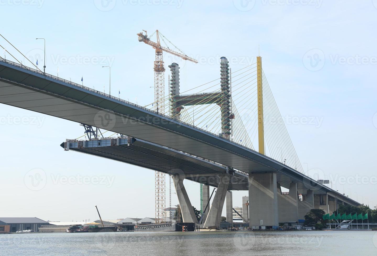 Suspension bridge under construction.  The bridge cross over Chao Phraya River in Bangkok Thailand. photo