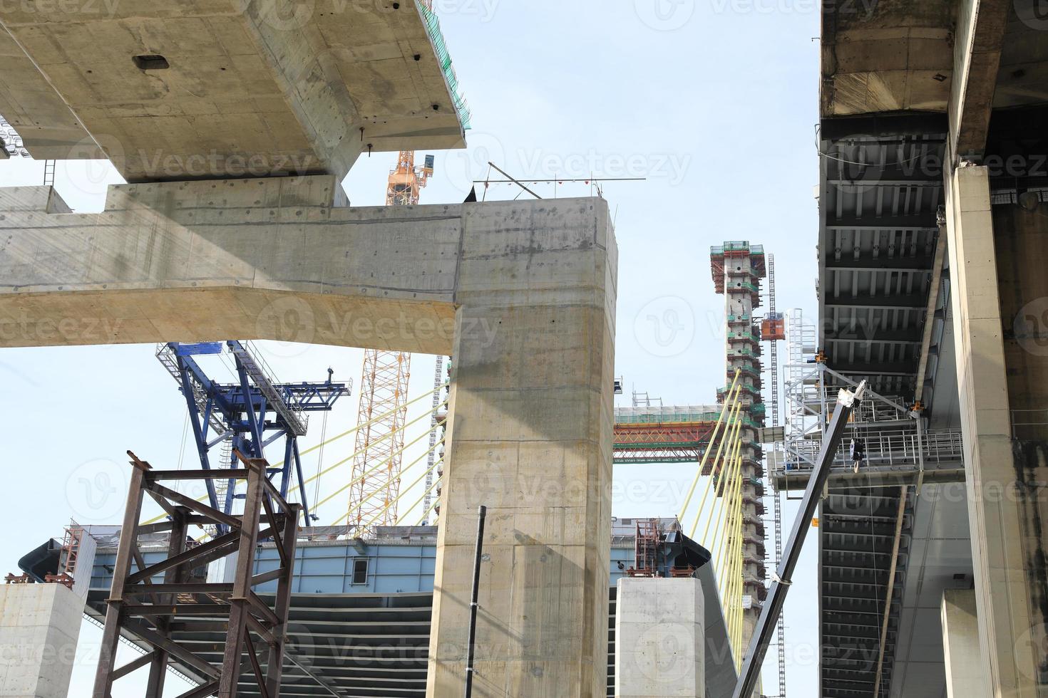 Large construction site. Suspension bridge execution of foundation. photo