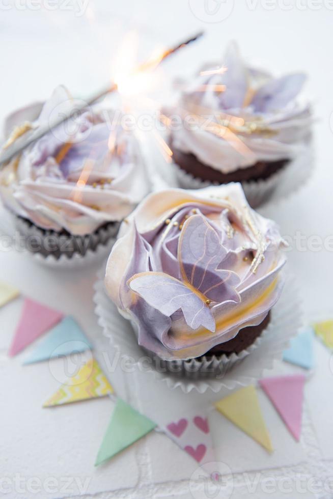 Cupcakes with butterfly decorations photo