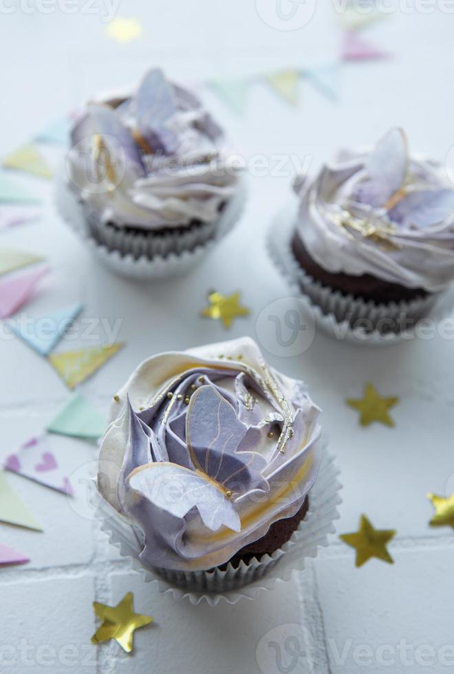 Cupcakes with butterfly decorations photo