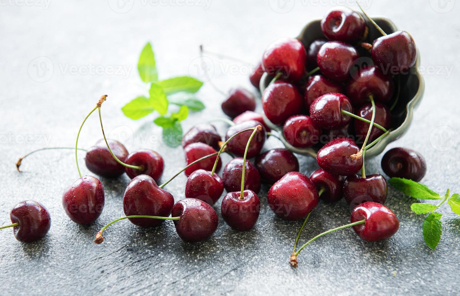 Fresh red cherries fruit in bowl photo