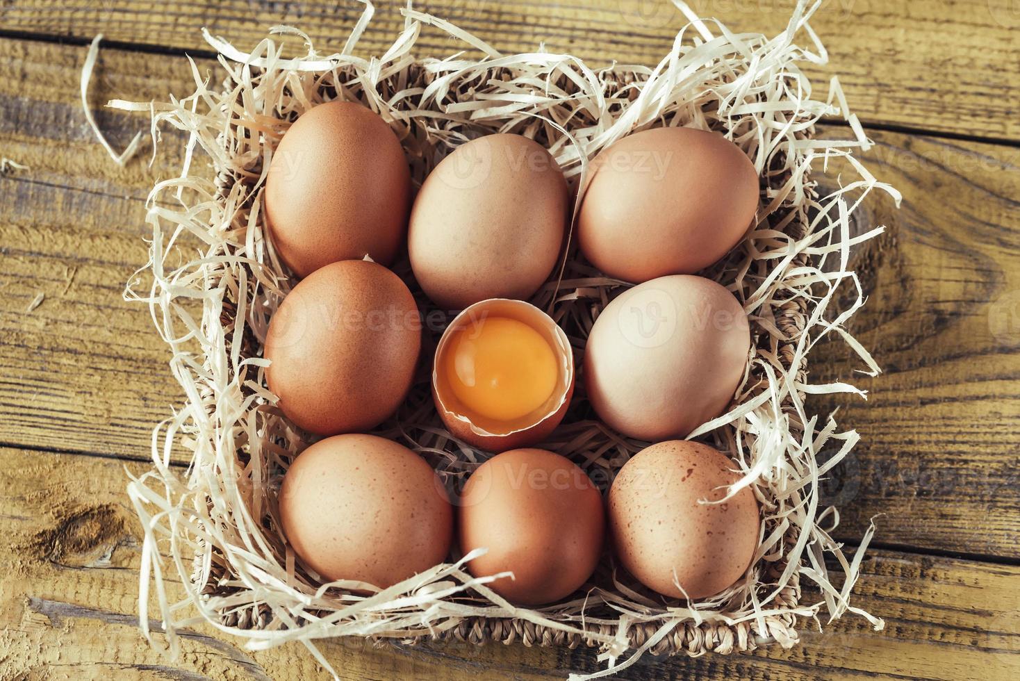 Basket of raw chicken eggs photo