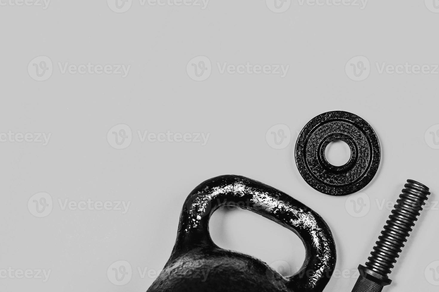 Kettlebell and dumbbell on color background. photo