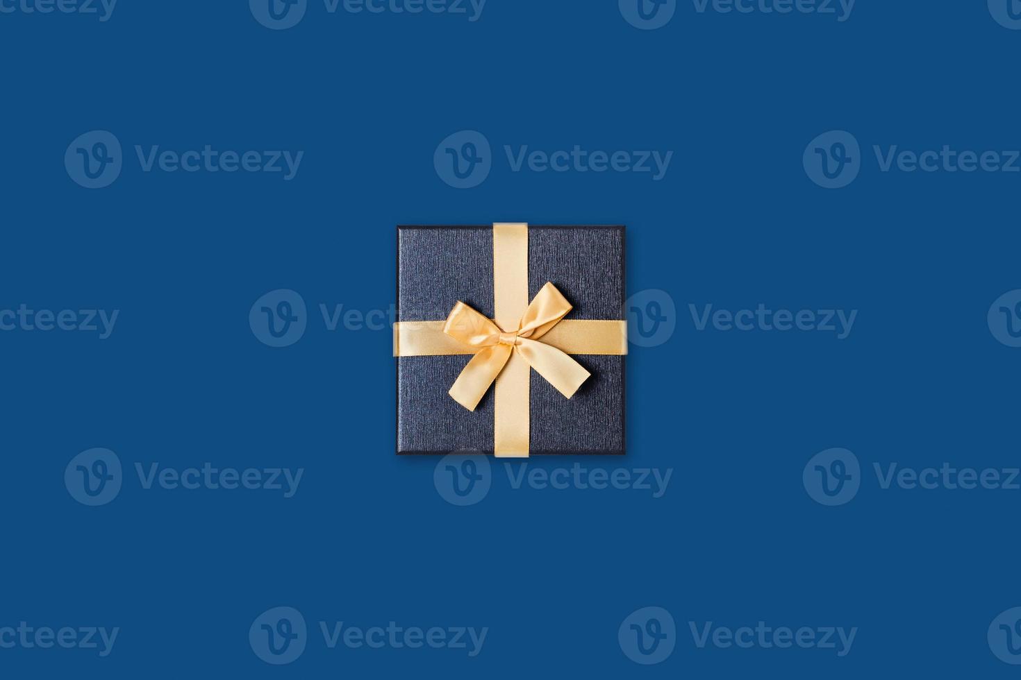 One gift box on blue background. photo