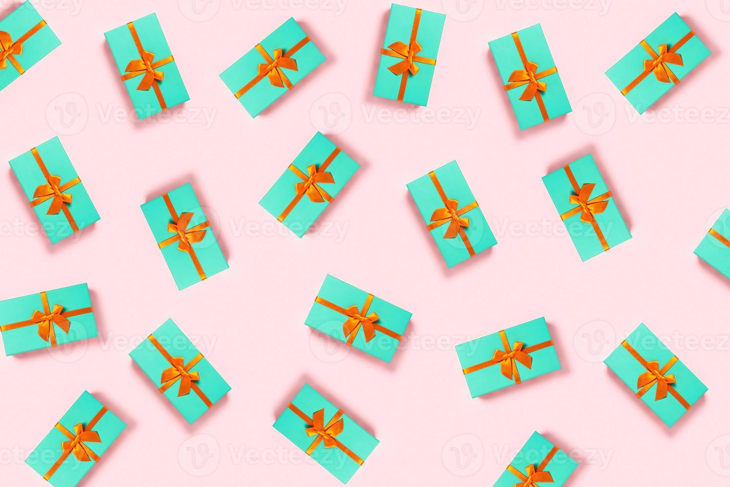 Mint gift boxex on a pink background. photo