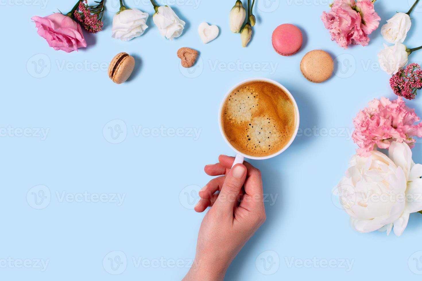 Greeting card with peonies and macaroons. photo