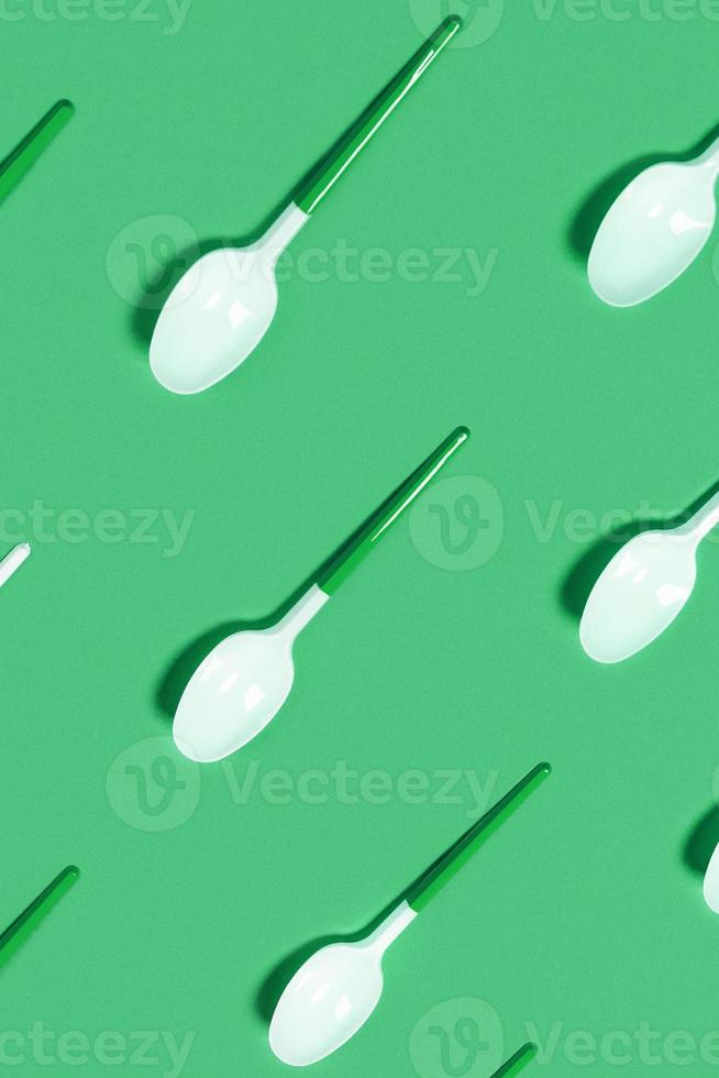 Pattern of withe spoon on blue background. photo