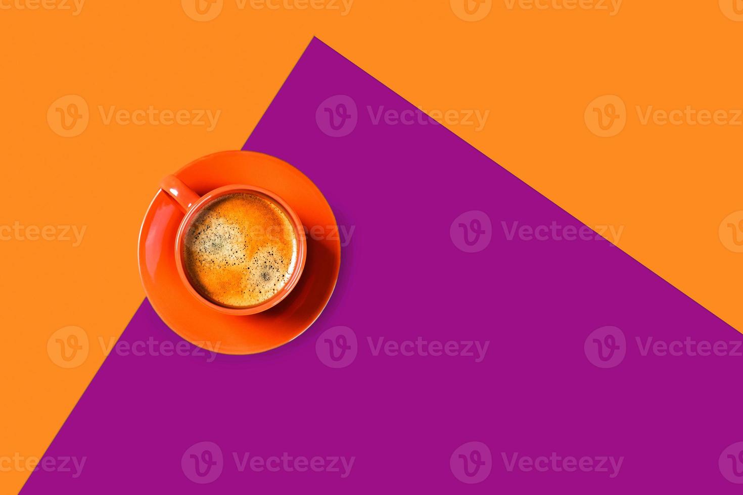One cup of coffee on two-toned background. photo