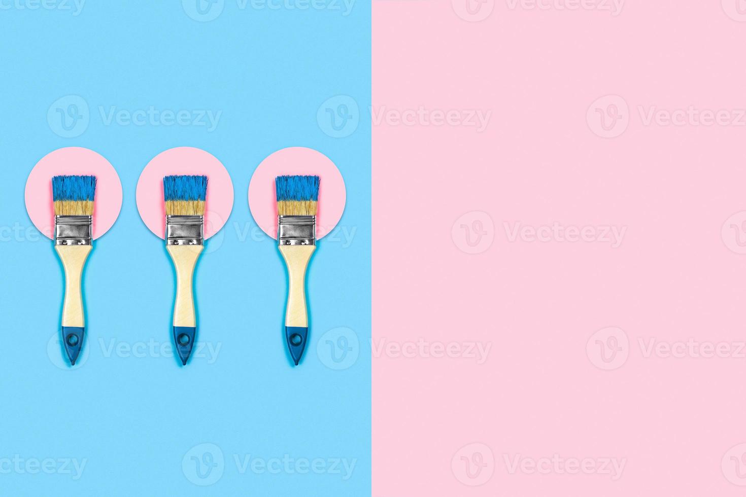 Colored background with paint brushes. photo