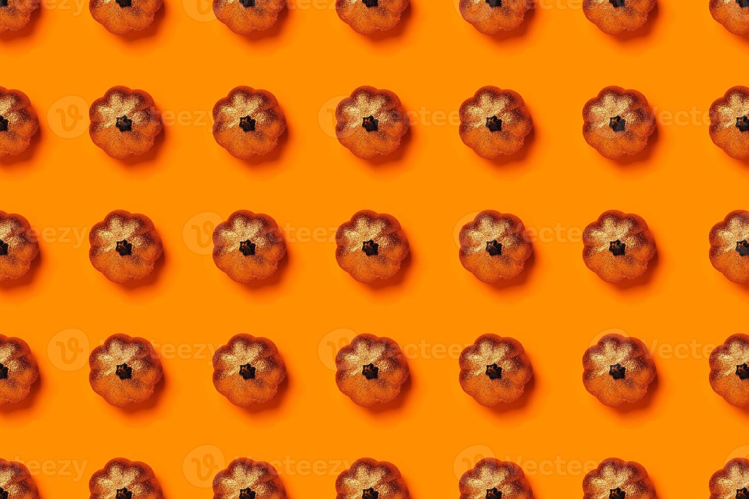 Halloween pattern of skeletons on orange background. photo