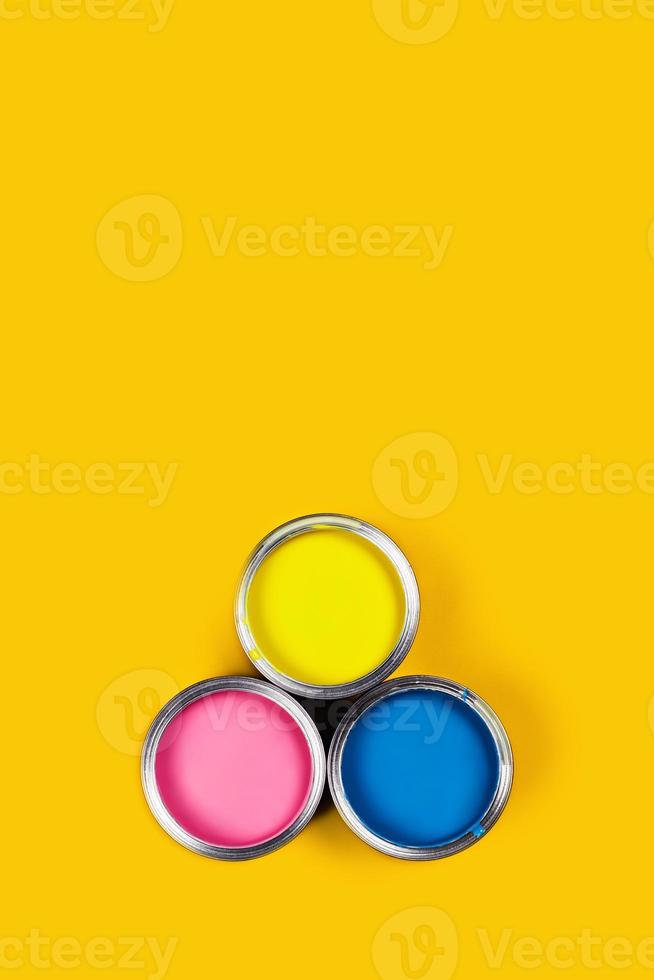 Colored background with paint jars. photo