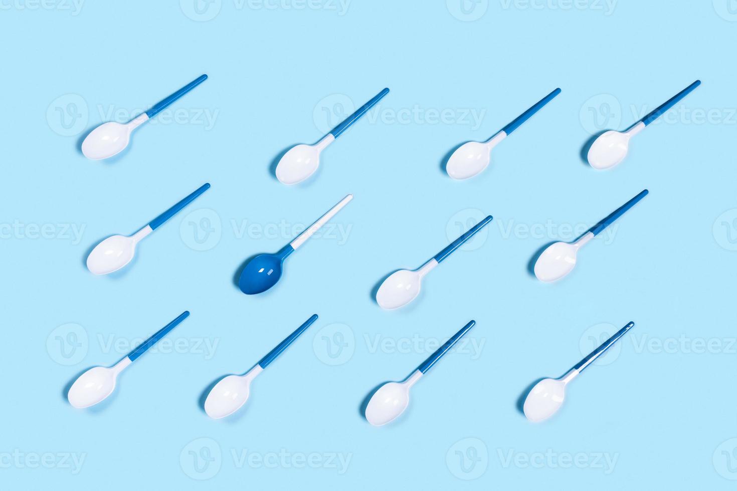 Pattern of withe spoon on blue background. photo