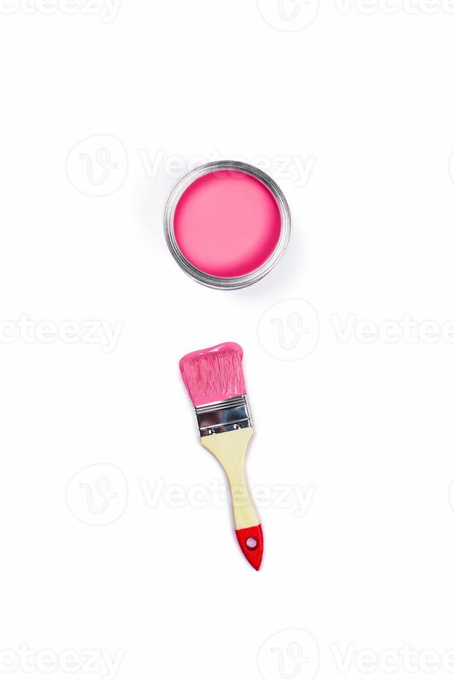 White background with one colored paint jar and brush. photo