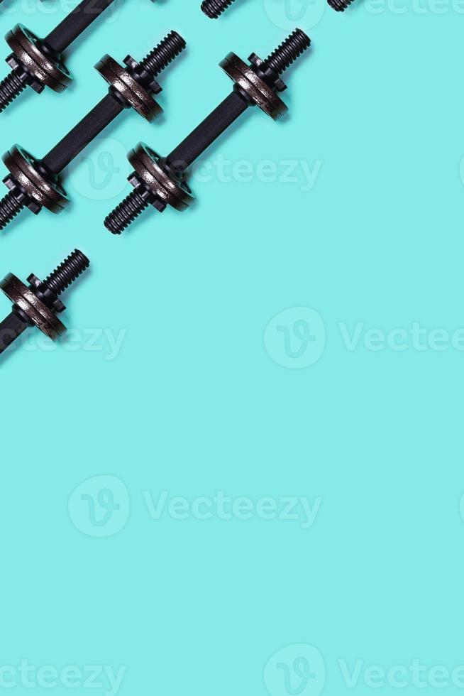 Dumbbell on color background. photo